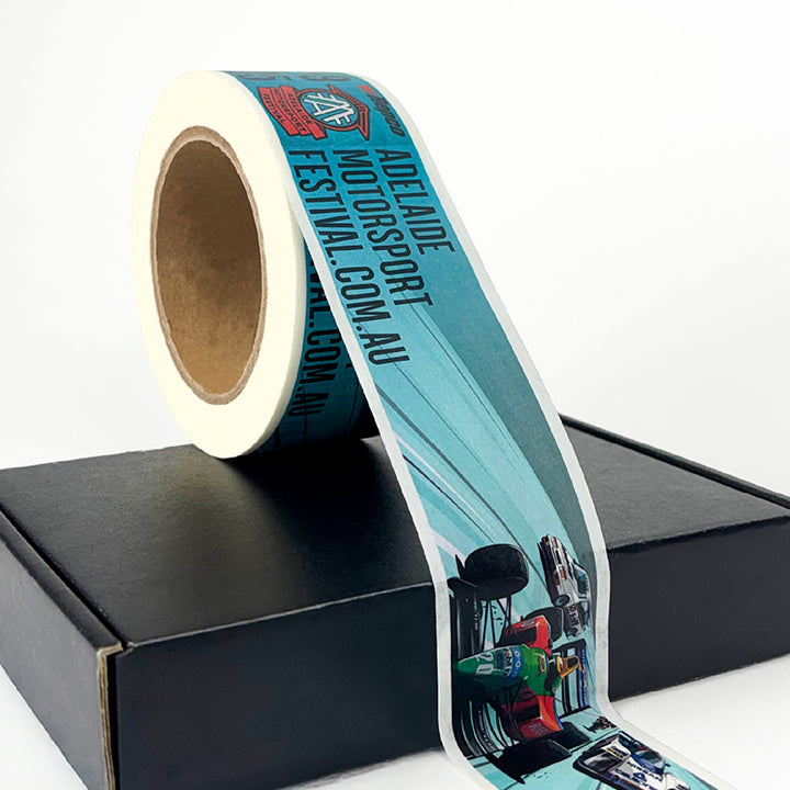 Roll of Adelaide Motorsport Festival promotional tape on a black box
