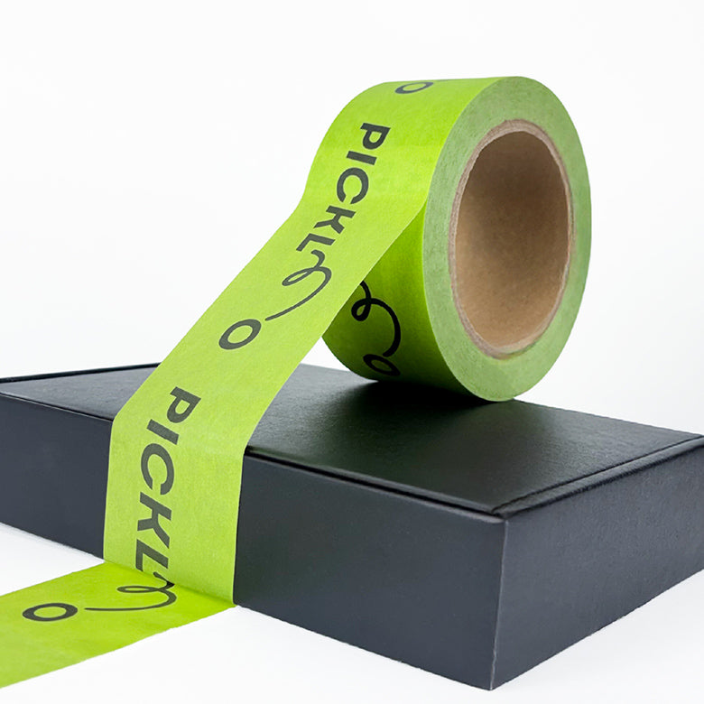 Green tape with 'PICKLE' branding on a black box